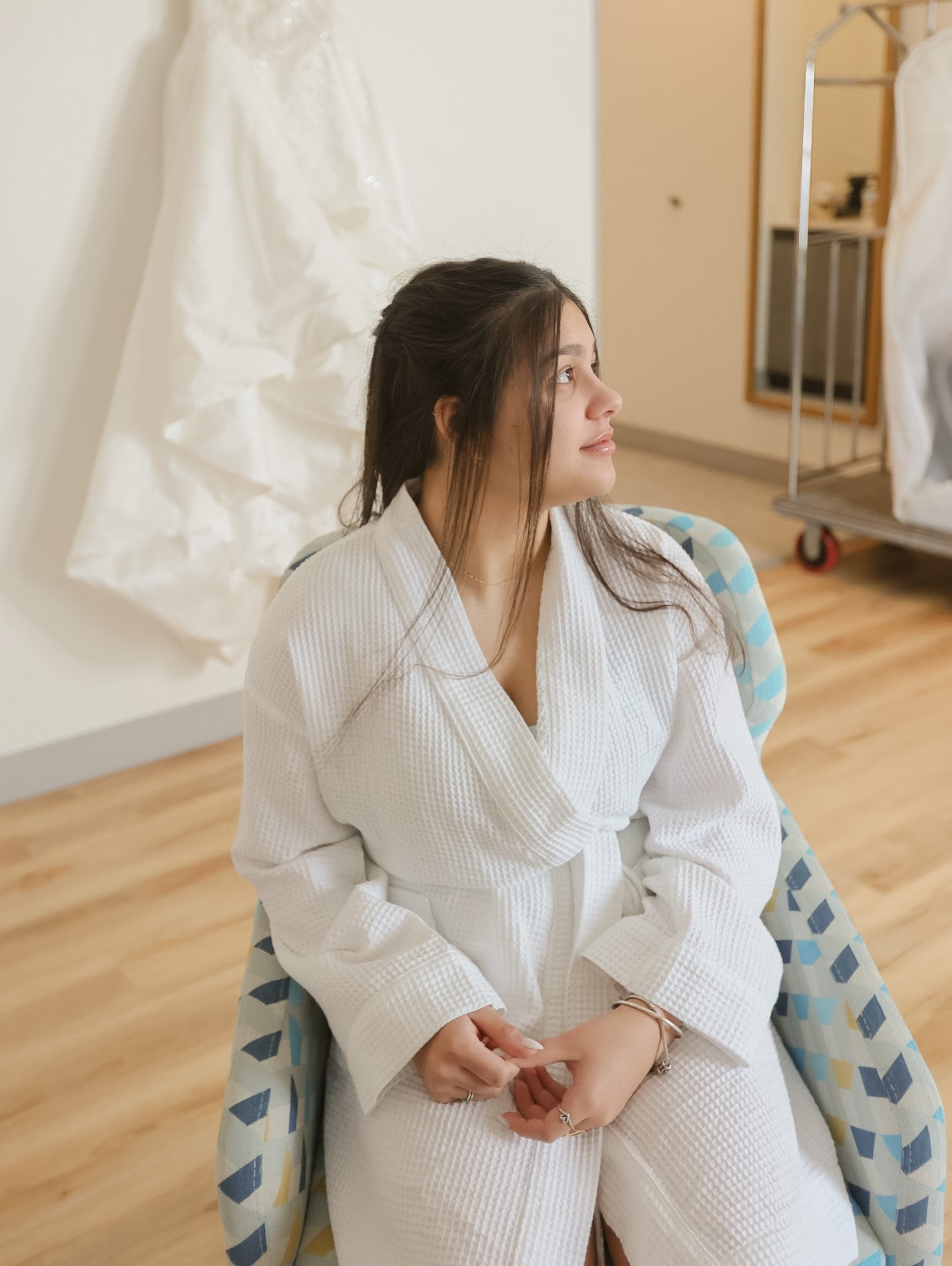 Bride in waffle robe before the ceremony